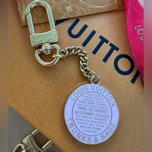 Lv luxury pink and gold Trunks and Bags medallion key chain or bag charm.